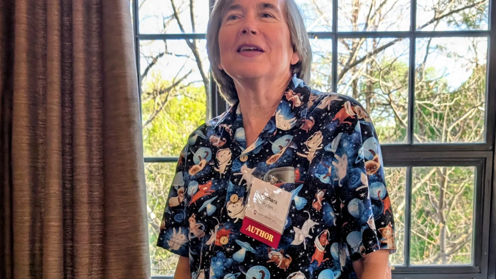 Barbara Ryden in front of her books